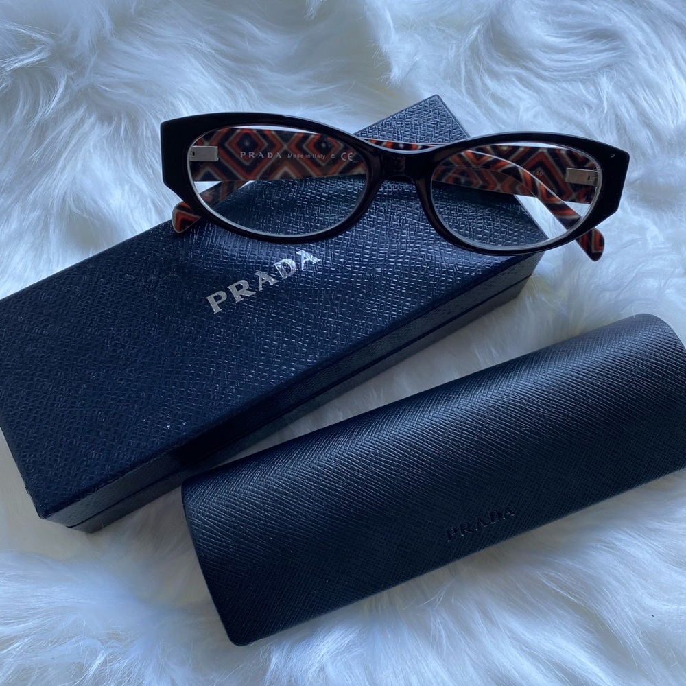 Prada glasses.